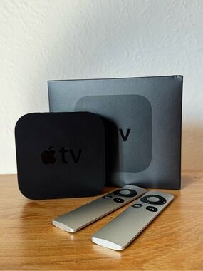 Apple TV Media Streamer in Black with Silver Remotes